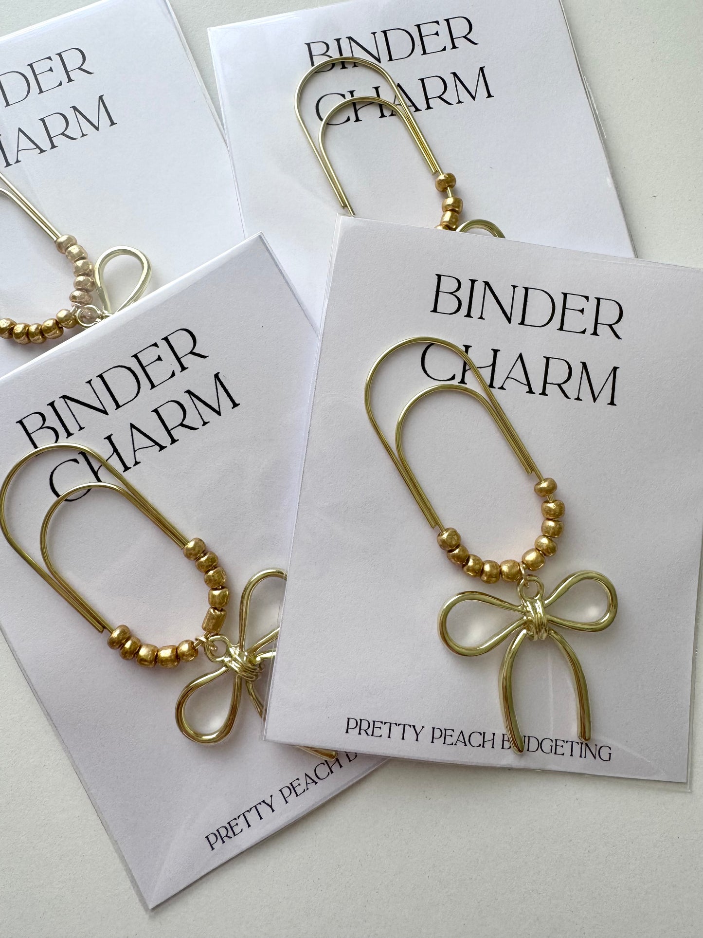 PAPERCLIP CHARM - GOLD BOW